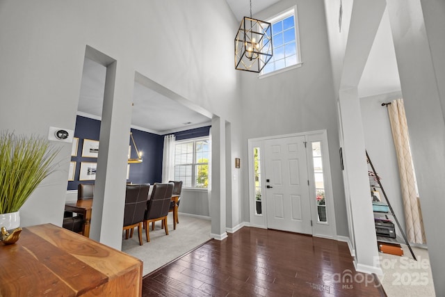 347 Wildbriar Rd Unit 28, Fletcher, NC 28732 - foyer with a chandelier, healthy amount of natural light, wood-type flooring, baseboards, and a towering ceiling