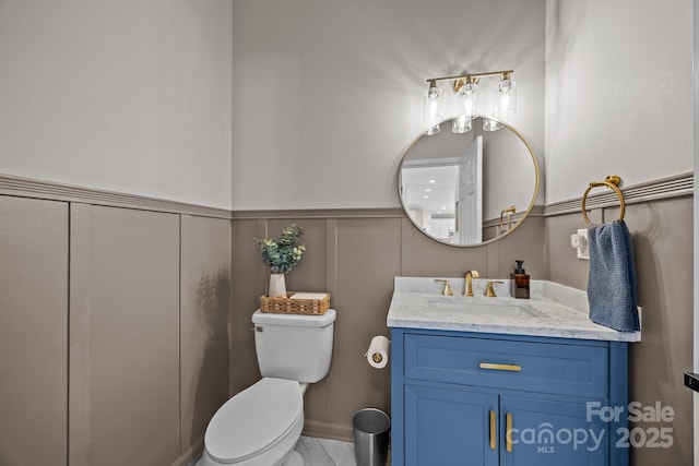 347 Wildbriar Rd Unit 28, Fletcher, NC 28732 - half bath featuring toilet, vanity, a decorative wall, and wainscoting
