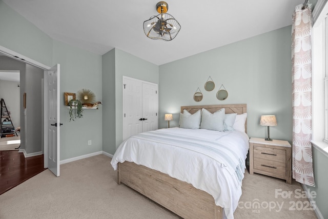 347 Wildbriar Rd Unit 28, Fletcher, NC 28732 - bedroom with light carpet, baseboards, a chandelier, and a closet