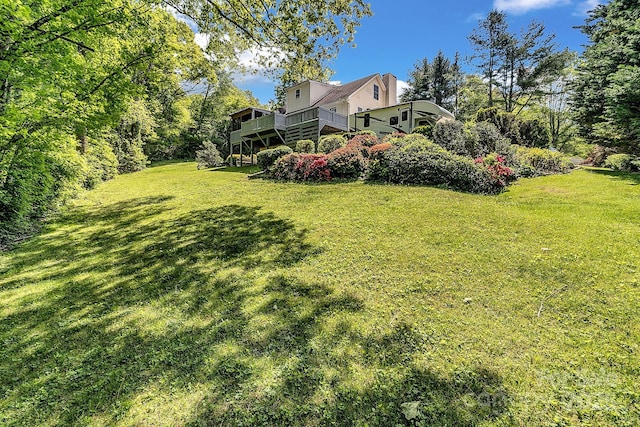 view of yard featuring a wooden deck