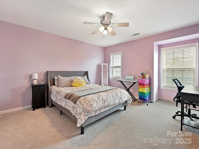 bedroom with light carpet, baseboards, visible vents, and a ceiling fan