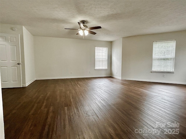 12713 Frank Wiley Ln, Charlotte, NC 28278 - empty room featuring a ceiling fan, dark wood finished floors, a textured ceiling, and baseboards