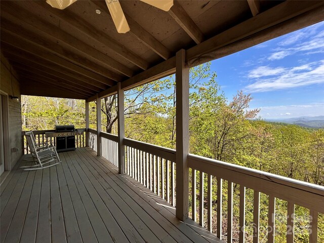 wooden terrace featuring area for grilling