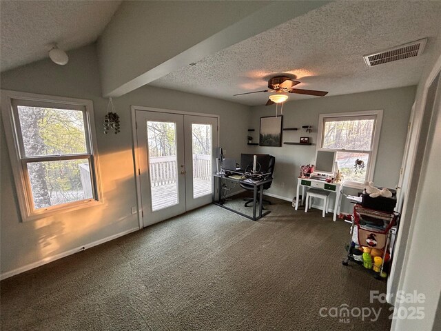 carpeted home office with a ceiling fan, a textured ceiling, french doors, baseboards, and visible vents