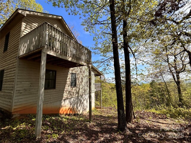 view of side of property with a deck
