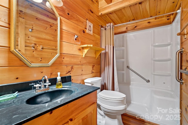 3110 Mentink Way, Nebo, NC 28761 - bathroom featuring vanity, toilet, wooden walls, and wood finished floors
