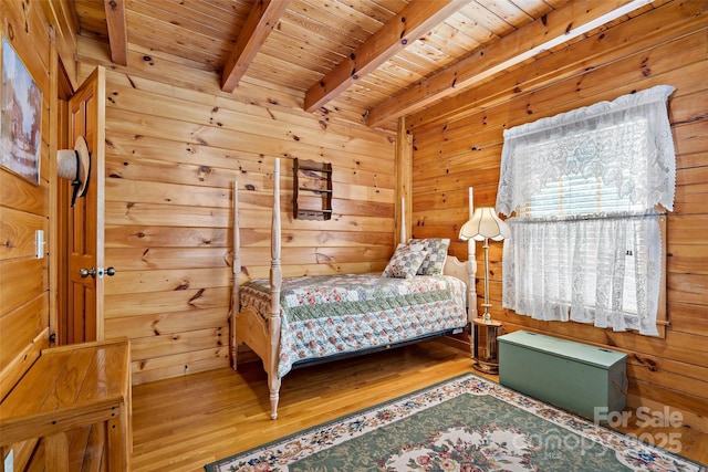 3110 Mentink Way, Nebo, NC 28761 - bedroom featuring wooden ceiling with exposed beams, wood finished floors, and wood walls