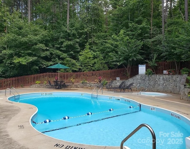 3110 Mentink Way, Nebo, NC 28761 - community pool featuring a patio and a forest view