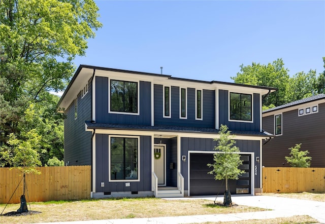554 W Cama St, Charlotte, NC 28217 - view of front of property featuring an attached garage, driveway, board and batten siding, and crawl space