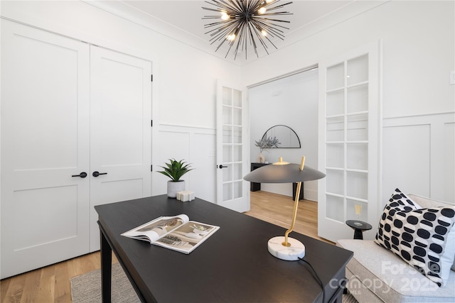 554 W Cama St, Charlotte, NC 28217 - office area featuring a decorative wall, light wood-style floors, french doors, a chandelier, and wainscoting