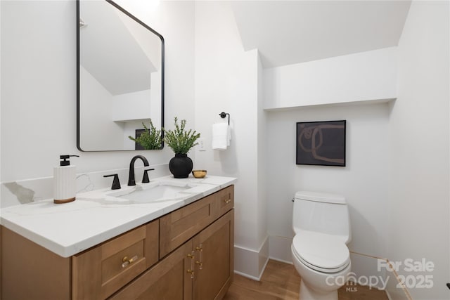 554 W Cama St, Charlotte, NC 28217 - bathroom with vanity, wood finished floors, toilet, and baseboards