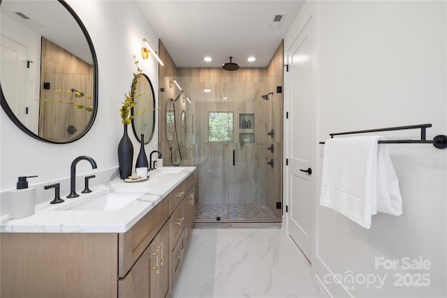554 W Cama St, Charlotte, NC 28217 - full bathroom with a stall shower, double vanity, marble finish flooring, and recessed lighting