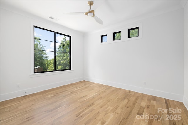 554 W Cama St, Charlotte, NC 28217 - unfurnished room featuring baseboards, light wood-style flooring, ceiling fan, and crown molding