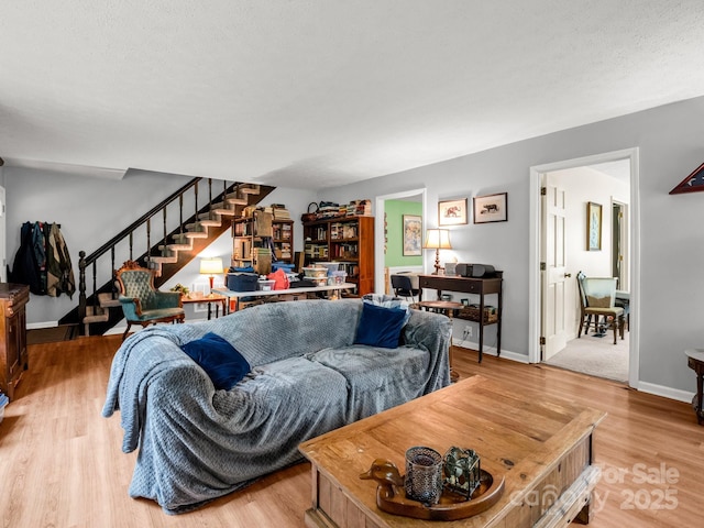 125 Snug Harbor Cir, Lake Lure, NC 28746 - living area with baseboards, stairs, and wood finished floors