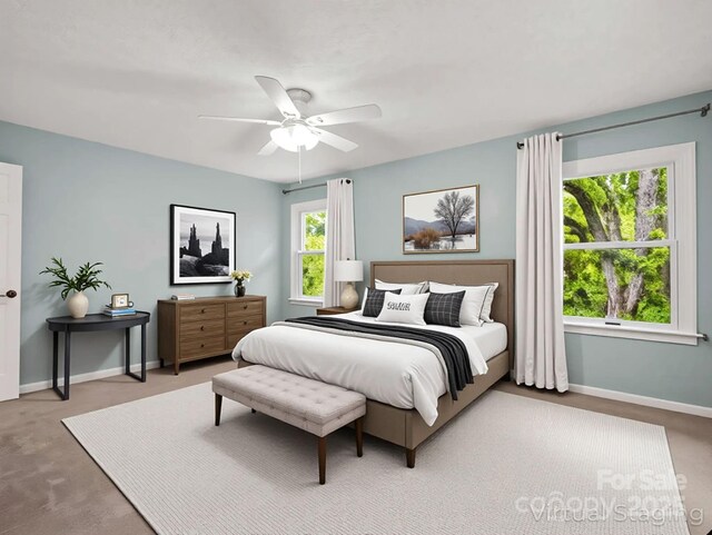 125 Snug Harbor Cir, Lake Lure, NC 28746 - bedroom with light carpet, baseboards, and a ceiling fan