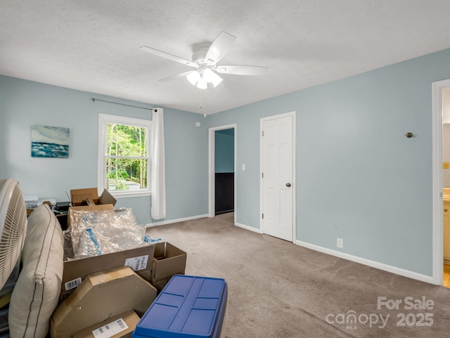 125 Snug Harbor Cir, Lake Lure, NC 28746 - living area featuring a ceiling fan, a textured ceiling, baseboards, and carpet