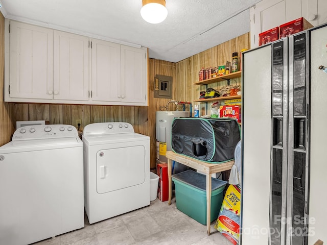 125 Snug Harbor Cir, Lake Lure, NC 28746 - laundry area featuring electric panel, wood walls, cabinet space, electric water heater, and washing machine and dryer