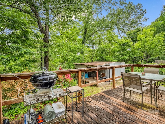 125 Snug Harbor Cir, Lake Lure, NC 28746 - wooden deck featuring outdoor dining area