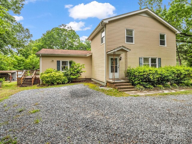 125 Snug Harbor Cir, Lake Lure, NC 28746 - traditional-style home featuring a wooden deck
