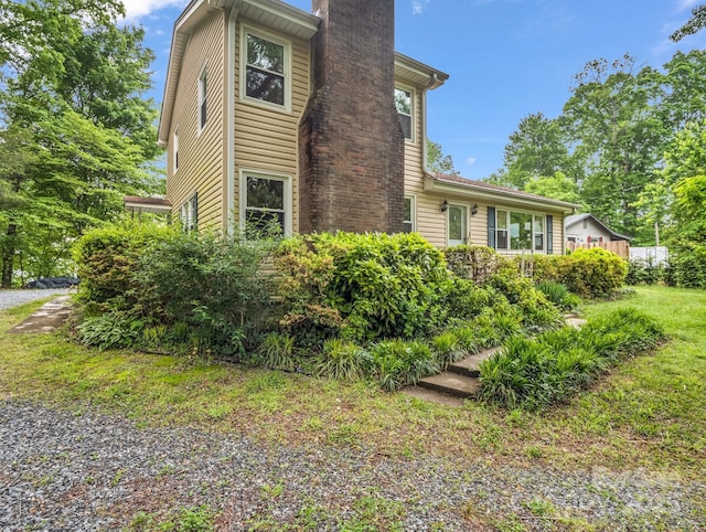 125 Snug Harbor Cir, Lake Lure, NC 28746 - view of property exterior featuring a chimney