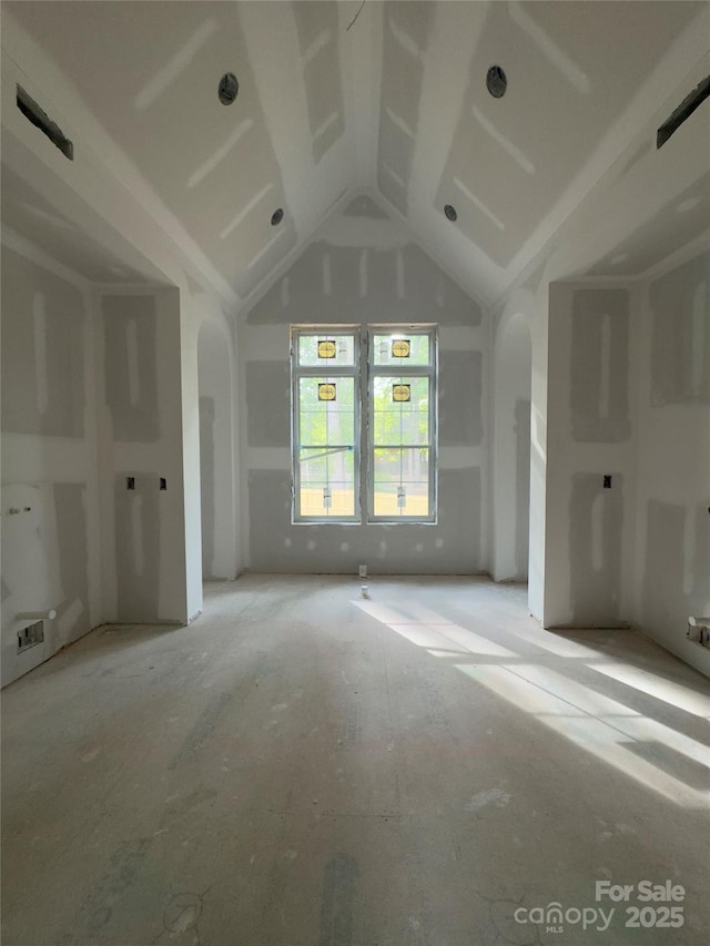 3030 Brookridge Ln, Charlotte, NC 28211 - unfurnished living room with arched walkways and lofted ceiling
