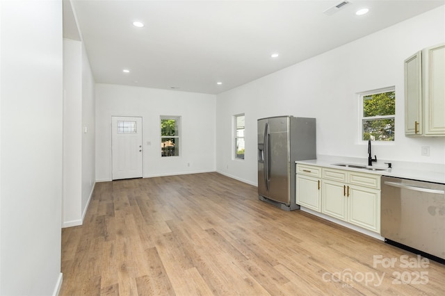 555 Pryor St, Chester, SC 29706 - kitchen featuring appliances with stainless steel finishes, a sink, light wood-style floors, light countertops, and visible vents