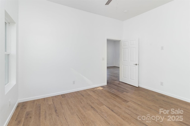 555 Pryor St, Chester, SC 29706 - empty room with baseboards, ceiling fan, and wood finished floors