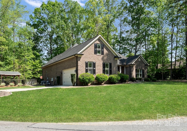 860 Arrow Point Ln, Davidson, NC 28036 - view of front facade with a front lawn, brick siding, and a garage