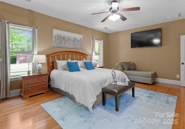860 Arrow Point Ln, Davidson, NC 28036 - bedroom featuring visible vents, ceiling fan, wood finished floors, and baseboards