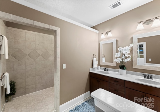 860 Arrow Point Ln, Davidson, NC 28036 - bathroom with double vanity, a walk in shower, visible vents, and a sink
