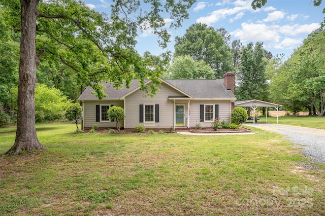 ranch-style house with roof with shingles, a chimney, gravel driveway, and a front yard