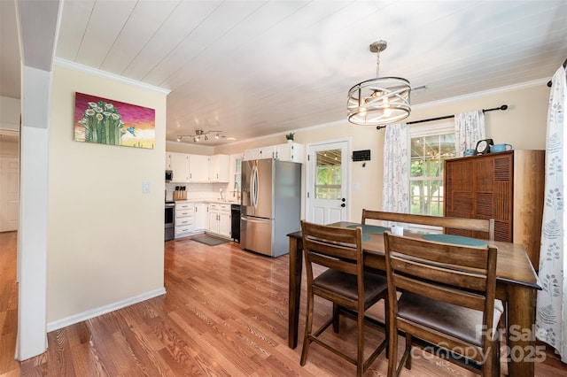 dining area with crown molding, an inviting chandelier, wooden ceiling, and wood finished floors