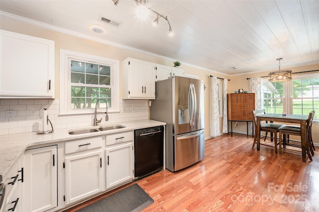 kitchen with white cabinets, a sink, black dishwasher, stainless steel refrigerator with ice dispenser, and visible vents