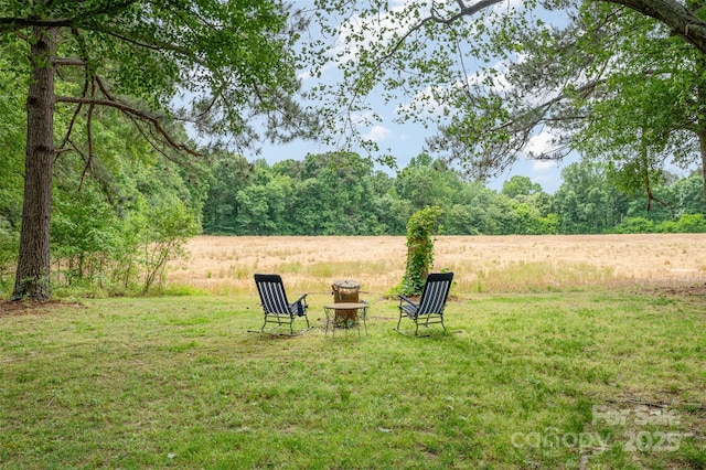 view of yard featuring a view of trees