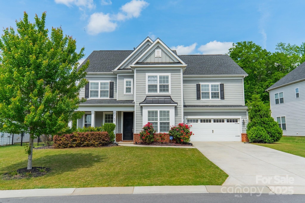 2164 Hanging Rock Rd, Fort Mill, SC 29715 - craftsman-style home with a garage, board and batten siding, driveway, and a front yard