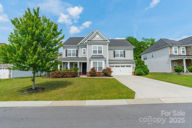 craftsman inspired home featuring a garage, covered porch, driveway, and a front yard
