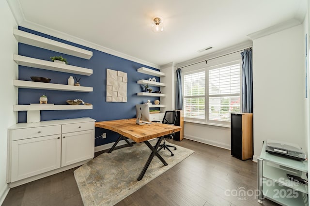 office space with crown molding, baseboards, dark wood-style flooring, and visible vents
