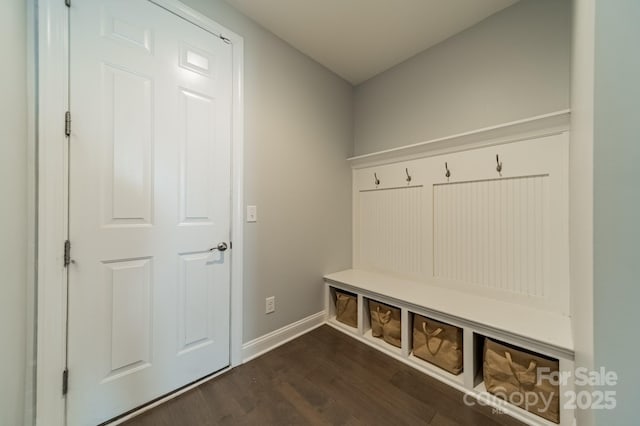 mudroom featuring baseboards and dark wood finished floors