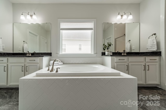 bathroom featuring a sink, a shower, a bath, and two vanities