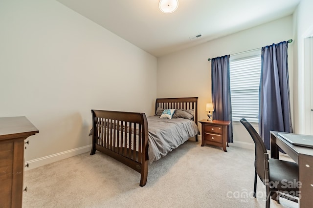 bedroom featuring light colored carpet, baseboards, and visible vents