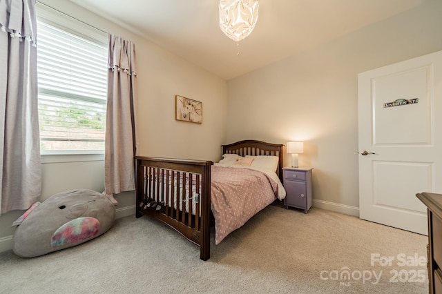 carpeted bedroom with baseboards