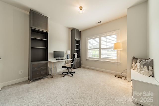 carpeted home office with baseboards and visible vents