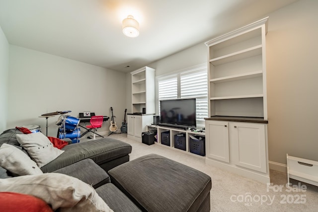 living room featuring carpet floors and baseboards