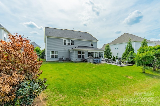 back of property featuring an outdoor hangout area, a patio, a yard, and central AC unit
