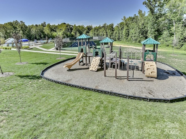communal playground featuring a lawn