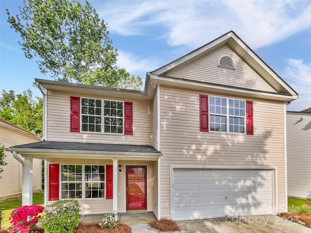traditional-style house with an attached garage and driveway
