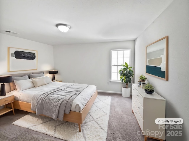 carpeted bedroom with baseboards and visible vents