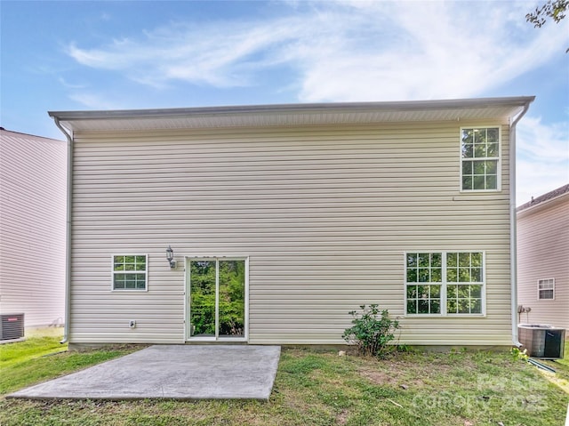 rear view of house featuring central AC and a patio