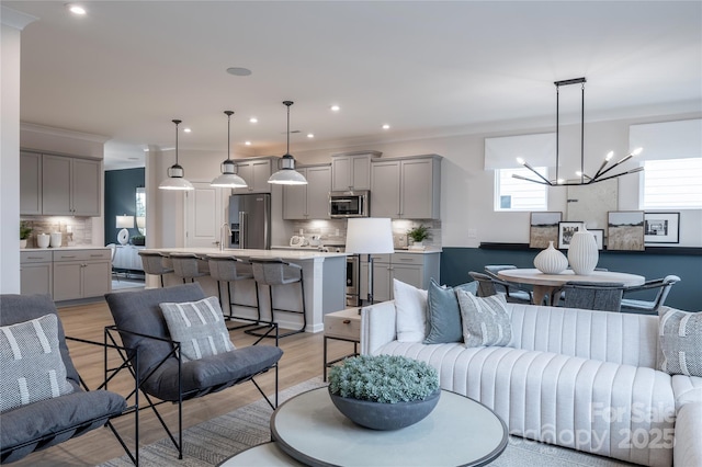 12017 Grinstead Ln Unit 301, Charlotte, NC 28278 - living room with a chandelier, light wood finished floors, and recessed lighting