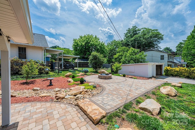 625 2nd St NE, Hickory, NC 28601 - view of patio with a fire pit and an outbuilding